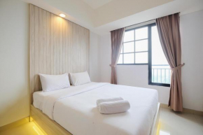 Minimalist 1BR with Extra Room at Evenciio Margonda Apartment By Travelio